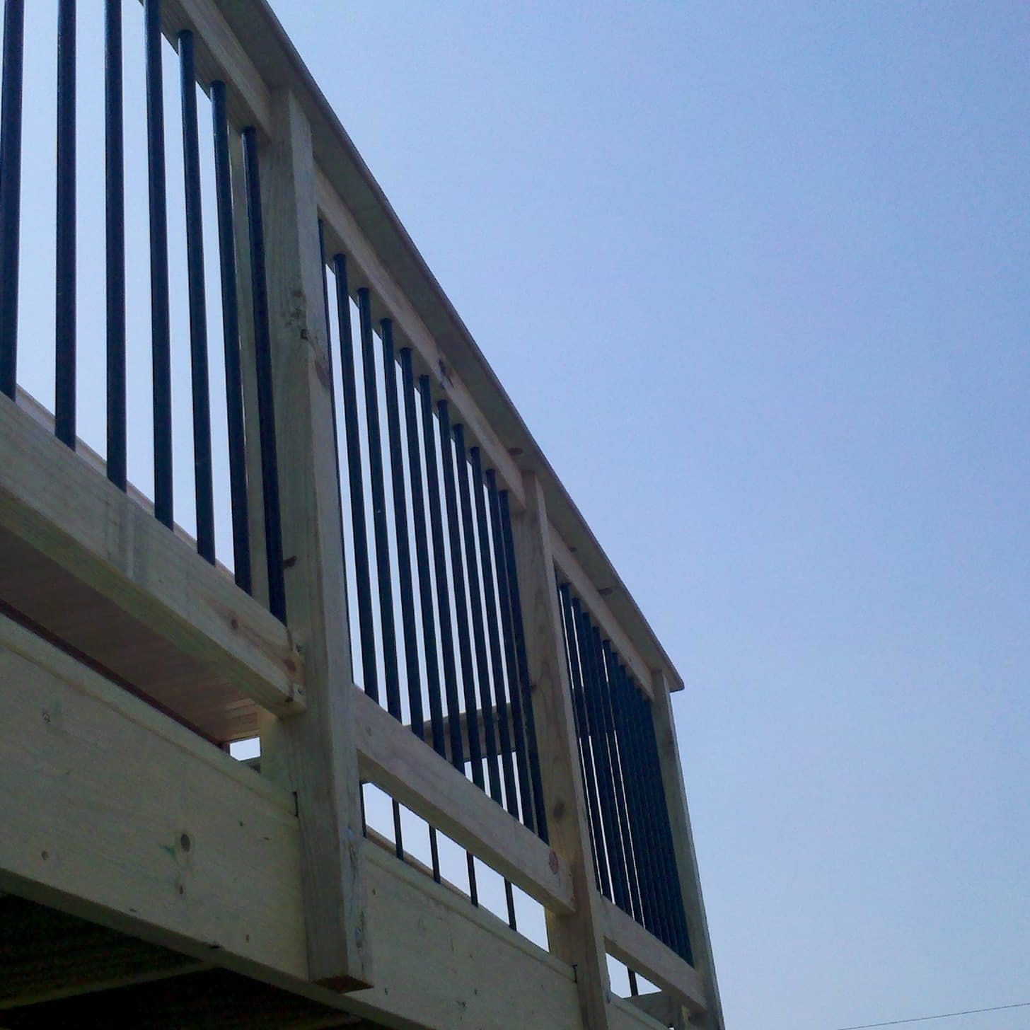 Wood railing with metal spindles
