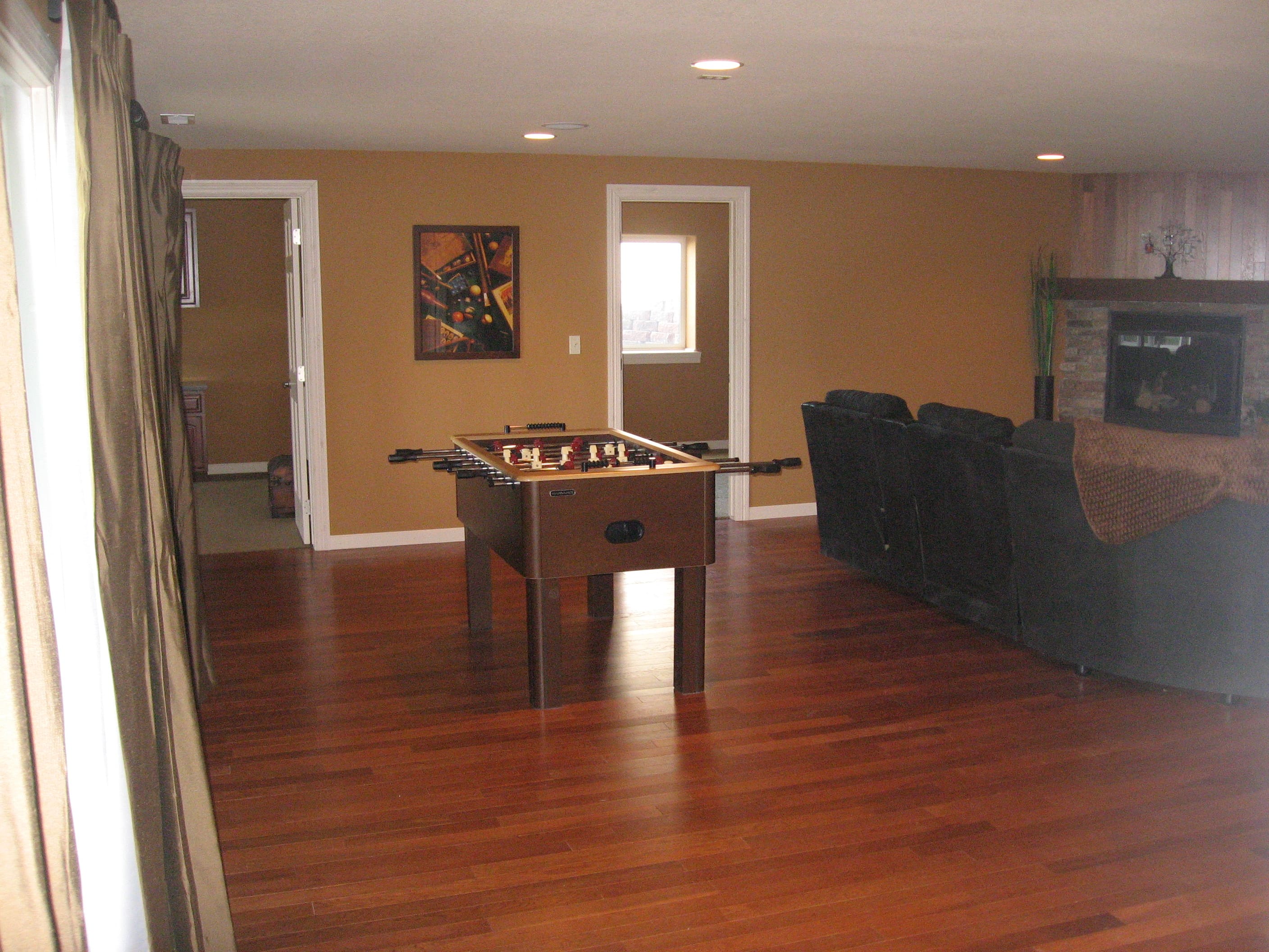 New home Living Room with Wood Floors and Fireplace