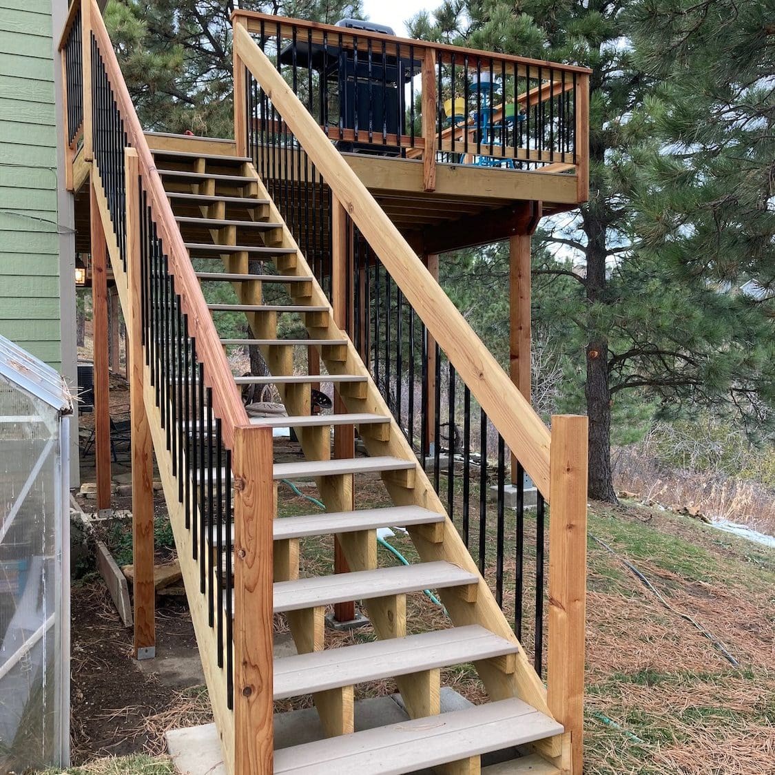Wood Deck Staircase with wood and metal railing