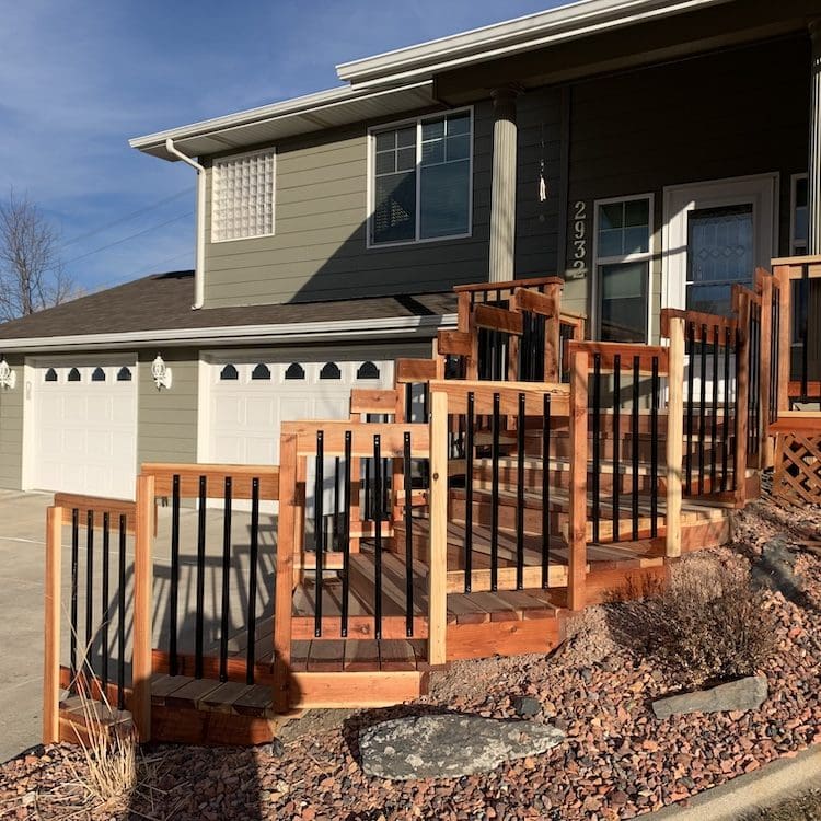cedar wood staircase with wood and metal railing