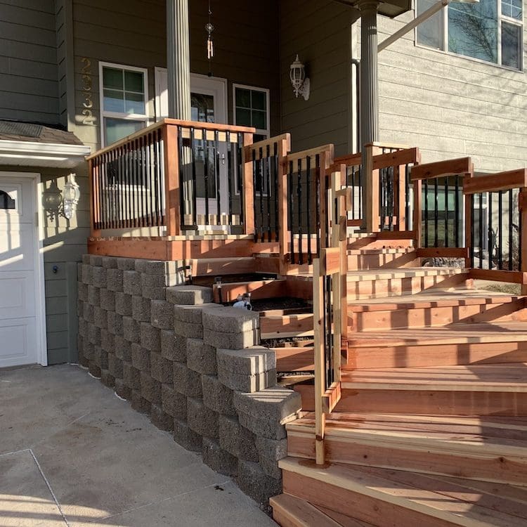 cedar wood staircase with wood and metal railing