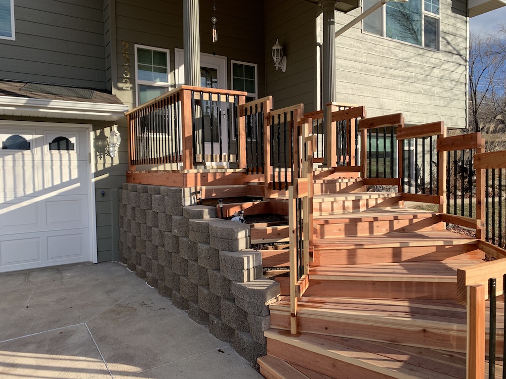 cedar wood staircase with wood and metal railing